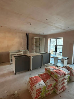 Kitchen renovation under construction with stone mason materials