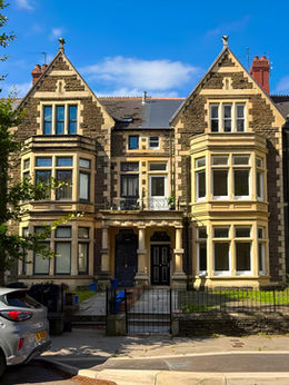 Victorian stone houses on Ninian Road with bay windows.