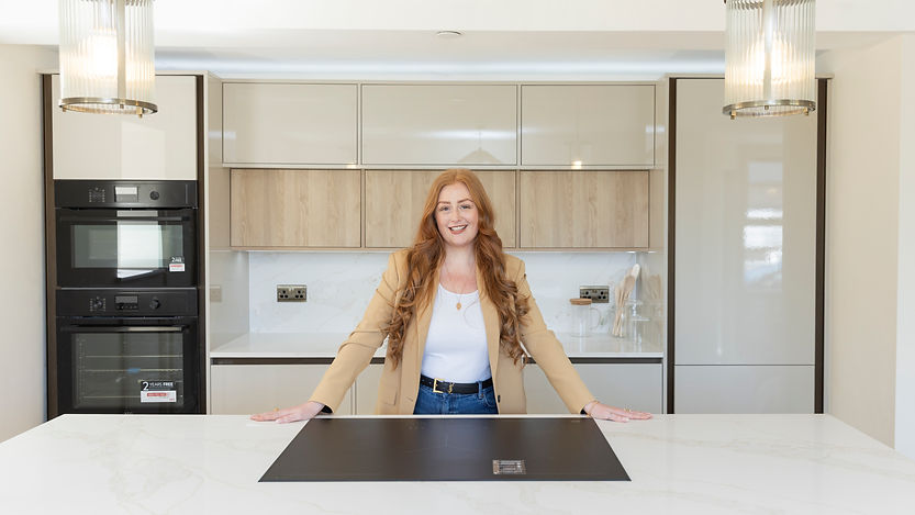 Smiling woman in a modern kitchen with minimalist cabinetry