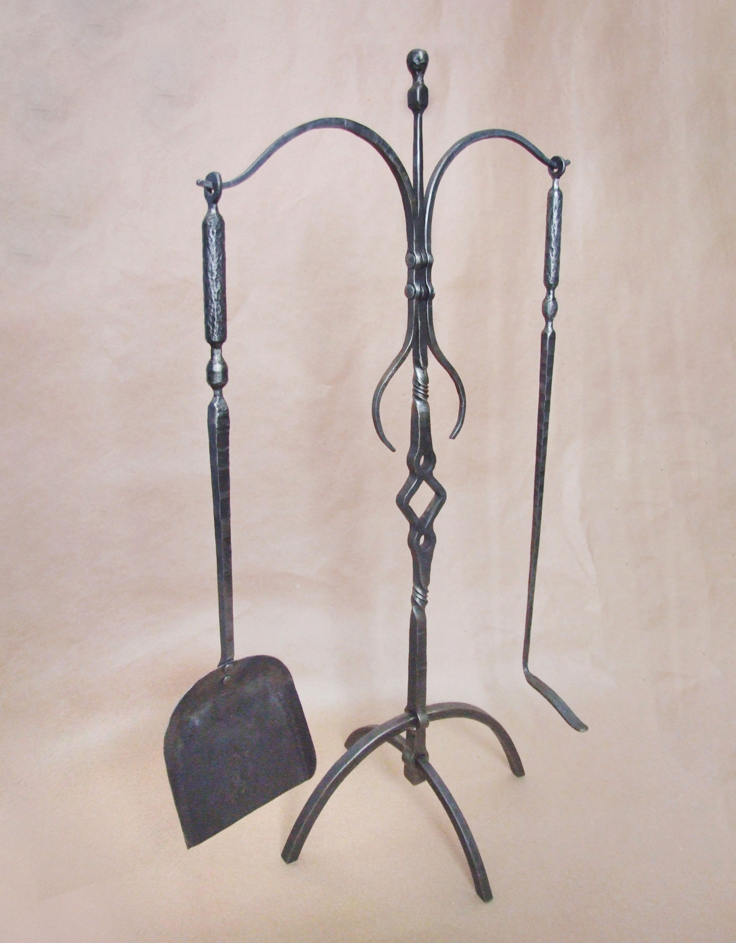 Hand forged fireplace tool set
