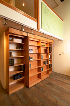 murphy bed with library doors and side cabinets
