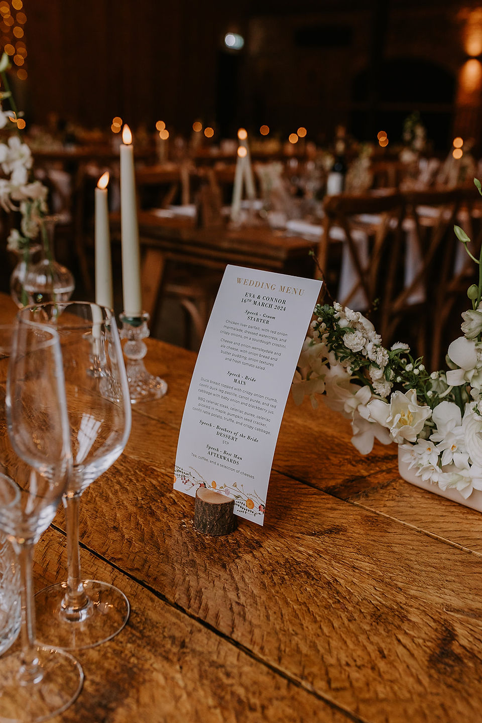 The wedding menu and table set up in the wedding barn at Lodge Farm Weddings.