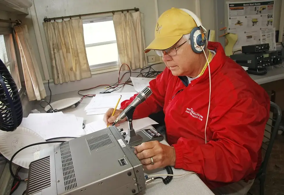 Ham radio operator Frank Krizan of Texas, who spends his summers in Scarborough, performs "Hunt and Pounce," a method of scanning the radio band for stations waiting for a turn to call them, during the 24-hour annual "Field Day" event capping off "Amateur Radio Week." The local chapter, the Portland Amateur Wireless Association, held the event at Fort Williams Park in Cape Elizabeth.(Photo by Jill Brady/Portland Press Herald via Getty Images)..