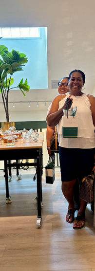 Customers walking through LatherGreen retail store exploring skincare and fragrance experience in Clearwater Florida