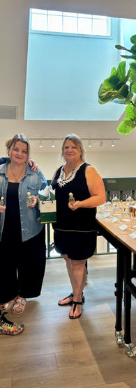 Customers participating in perfume making experience at LatherGreen scent blending studio in Clearwater Florida
