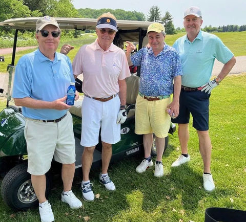 men playing golf drinking Cause Water