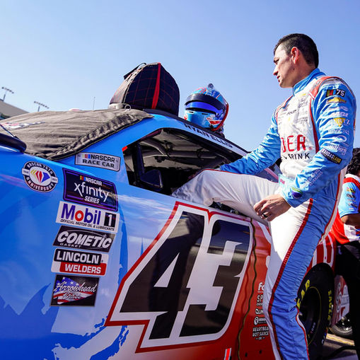 Race Car Driver Ryan Ellis exiting Spider Energy Race Car