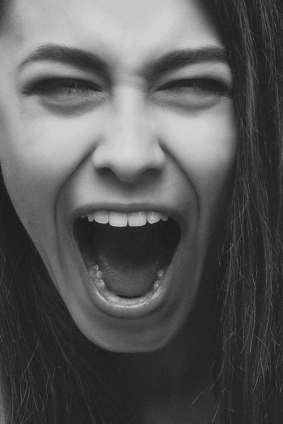 A woman shouting and stressed.