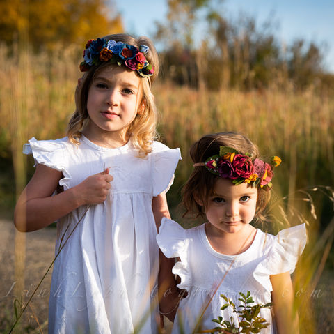 Beautiful girls in flower crowns among prairie grass. Calgary, Alberta.