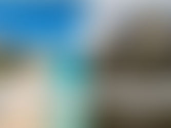 A beautiful picture perfect sandy beach resort compared to a hurricane ravaged resort hotel