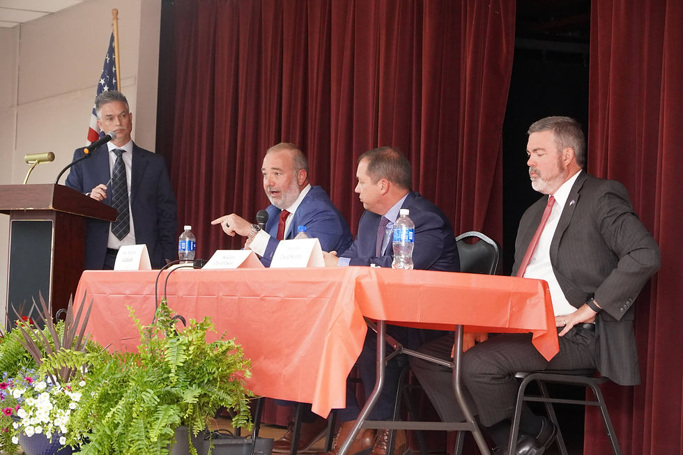 Senator Stephen Goldfinch (left) challenges David Pascoe over campaign finances as David Stumbo (right) listens during a heated exchange at the Horry County Republican Party Attorney General debate in Myrtle Beach. JavarJuarez©2026