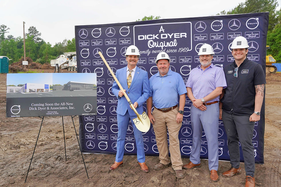 Hunt Dyer, CEO of Dick Dyer & Associates, holds a ceremonial gold shovel at the groundbreaking of the company’s new Jamil Road facility in Columbia’s 29210 corridor, joined by project engineers on-site. JavarJuarez©2026