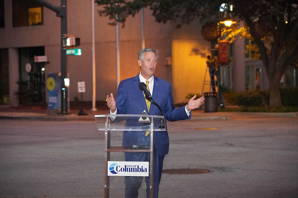Columbia Mayor Daniel Rickenmann speaks during Wednesday night’s unveiling of the new Main Street lighting project in downtown Columbia. JavarJuarez©2026