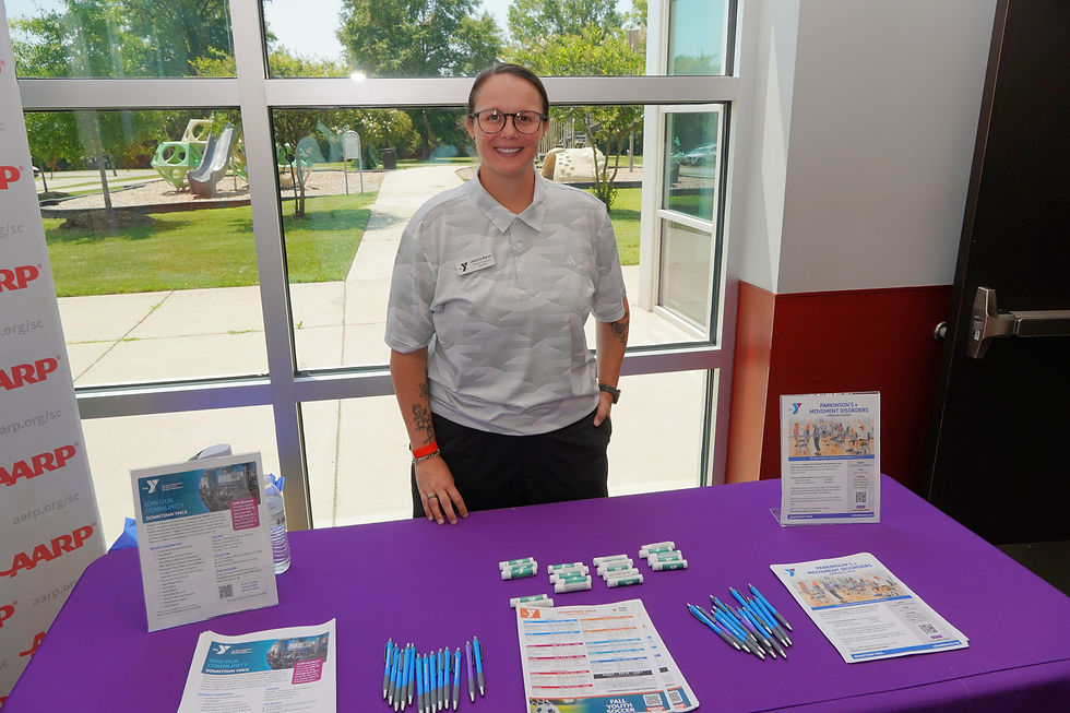 Jessica Bacon of the Downtown YMCA shares information about wellness programs and community resources during AARP South Carolina’s Café Voyage event at the Busby Street Community Center on June 11, 2026. JavarJuarez©2026