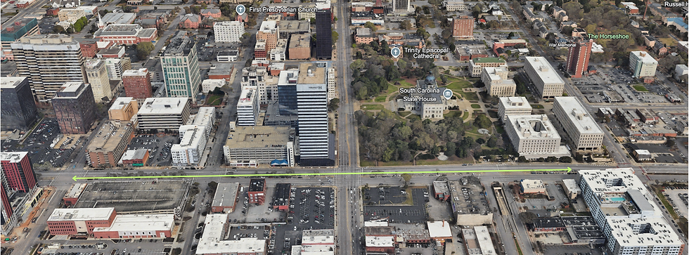 An aerial view illustrates the full scale of the proposed Main Street/Vista Connector project along Assembly Street, spanning a critical corridor between the State House, Main Street, and the Vista district. Google Earth
