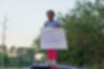 A young child holds a “Justice for Cyrus” sign during a protest on Parklane Road near the site where Cyrus Carmack-Belton was fatally shot, June 2, 2026, in Columbia, South Carolina. JavarJuarez©2026
