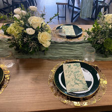 Table Setting with Flowers, Plates, Runner, and Napkins