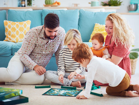 A family happily playing a board game