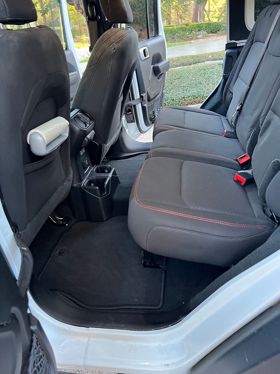 Back seat interior after detailing in Brazoria County TX with deep cleaned seats and spotless carpet