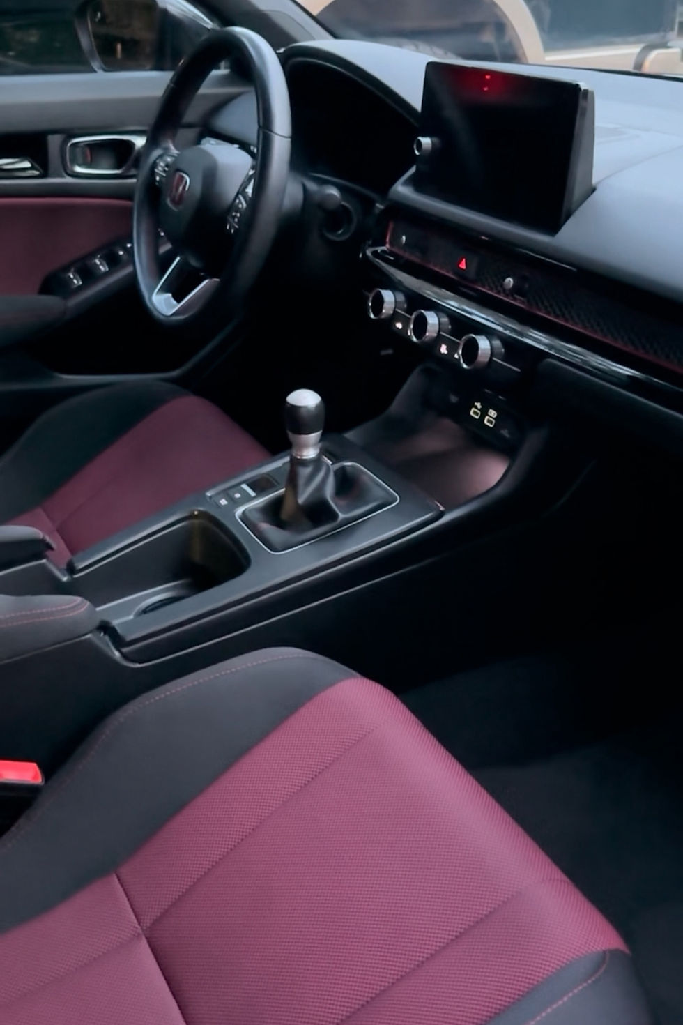 Clean interior detailing of manual sports car in Angleton TX with vacuumed seats and center console