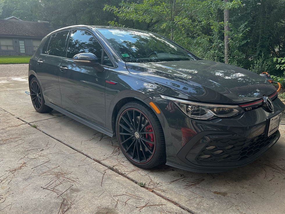 Black Volkswagen GTI before detailing in Angleton TX with dull paint and surface contamination