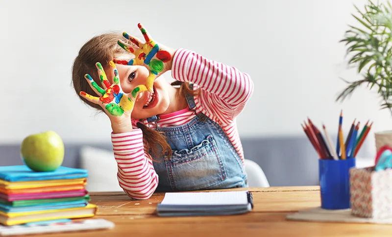 child-with-finger-paint.webp
