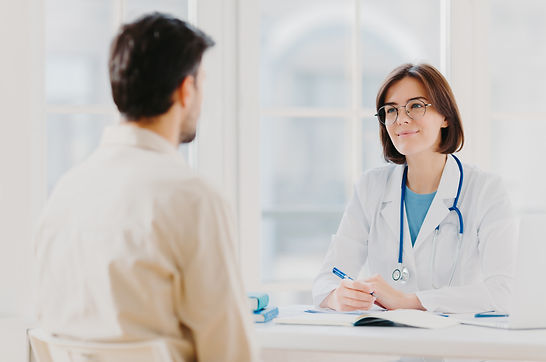 doctor-and-patient-discuss-something-sit-at-table-2022-01-11-01-44-21-utc (1).jpg