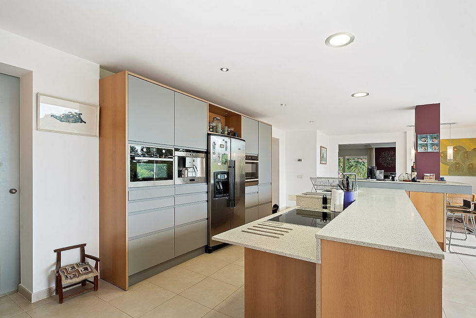 Kitchen with wooden cabinetry and central island, Costa de los Pinos villa