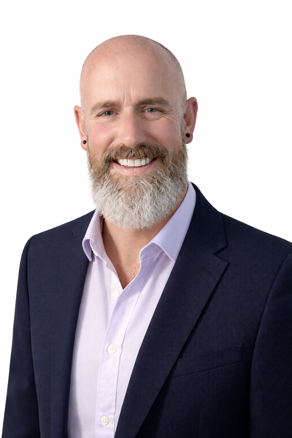 Portrait of a person in a dark suit with a lilac shirt on a clean background, suitable for a professional managing director headshot.