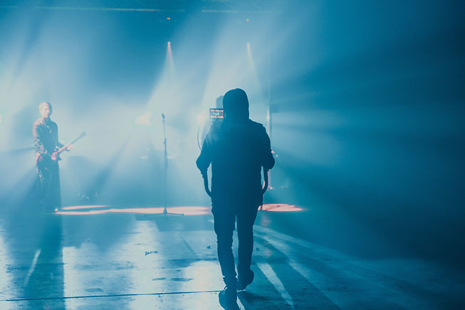 Camera Operator Using Gimbal at Concert