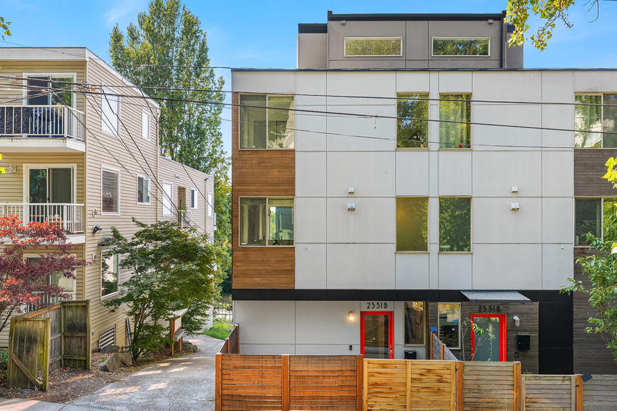 Perched above the city, elevated & modern living meets sweeping Seattle panoramas in this light filled North Beacon Hill home. Positioned on a SE corner, this stylish 3 level home frames stunning westerly views of Downtown, Elliott Bay, the Puget Sound, & Olympic Mountains, with unforgettable sunsets from the private rooftop deck. Soaring ceilings, oversized windows, & rich hardwoods create bright & airy interiors. Enjoy city living with multi level spaces that unfold with an effortless sense of dimension, from the dramatic living room to an elevated dining area & beautifully appointed kitchen updated with a stainless steel appliance package, Bertazzoni gas range & new tile backsplash. Upstairs, two serene bedrooms with new carpets, including a private primary suite with spa bath. The rooftop level reveals the home's defining experience, an expansive open roof top retreat framed by panoramic westerly views. Spend summer evenings above the city, watching the skyline glow & sunsets disappear beyond the Olympics. A fully fenced front patio offers another outdoor escape, with an oversized 1 car garage + abundant storage, mini split heating & cooling, & tankless hot water bring ease to everyday living. Moments from light rail & the energy of the city, this is an elevated expression of modern Seattle living.