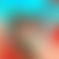 A group of women wearing wedding attire smiling and laughing inside a ventage camper