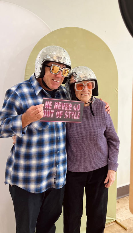 Old couple wearing disco helmets