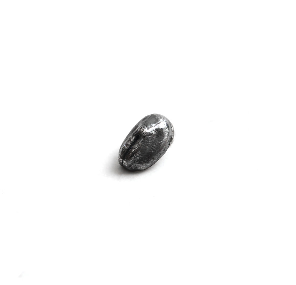 Vulva shaped tie tack.