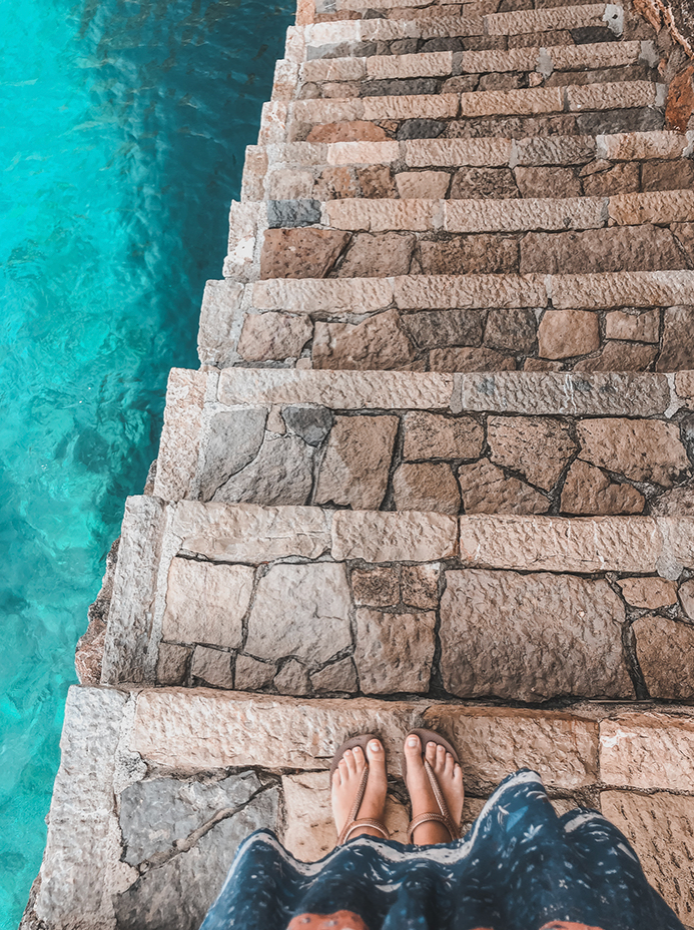 Stairs next to turquoise water Mediterranean Sea in Palma de Mallorca