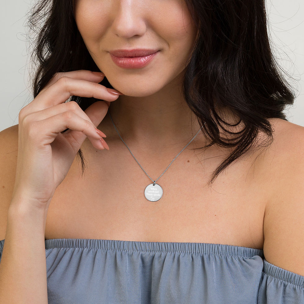 Thumbnail: Engraved Silver Disc Necklace "When words fail Music speaks"