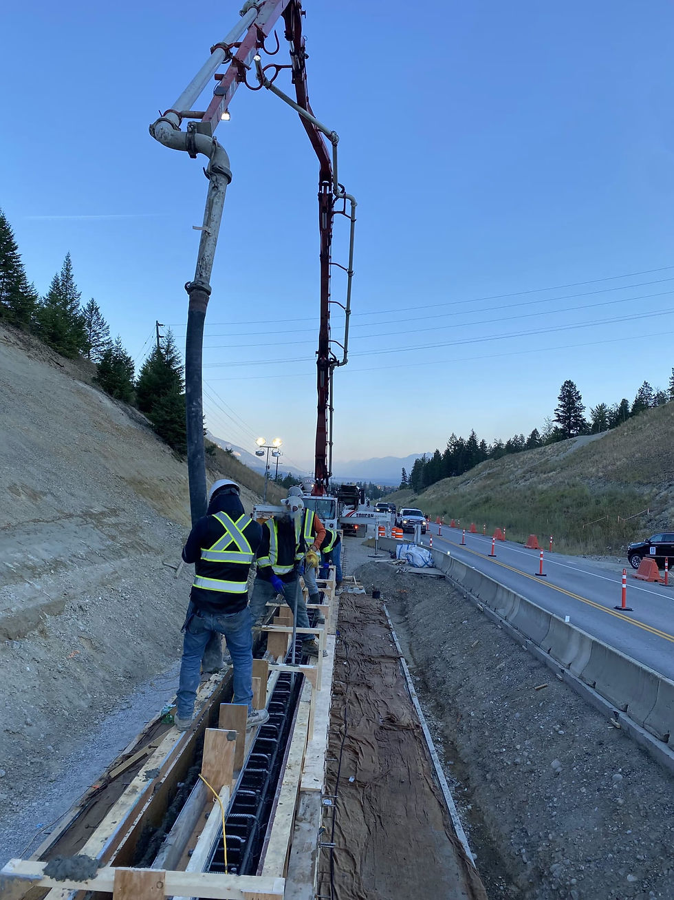 Industrial concrete pumping and pouring for a major highway structural project using specialized boom pump equipment.