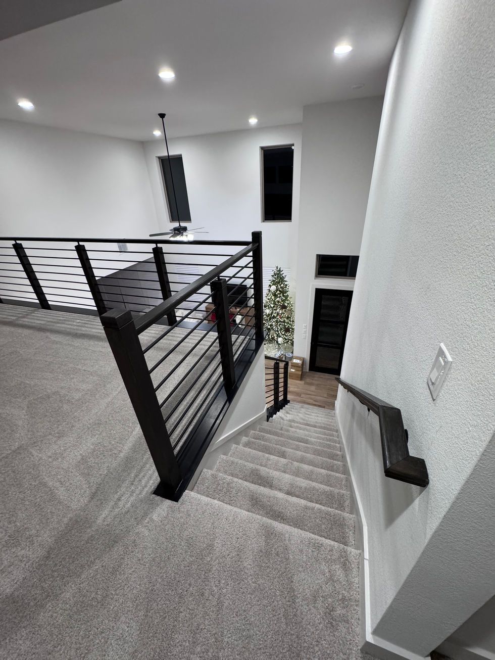 Modern staircase remodel • Custom railing installation • Horizontal railing system • Staircase renovation • Interior remodel • Luxury home renovation • Custom stair railing • Modern interior design • General contractor