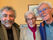 Claude Defiolle, antenniste à Questembert souriant avec deux clients satisfaits après une installation réussie, reflétant son engagement pour la qualité.