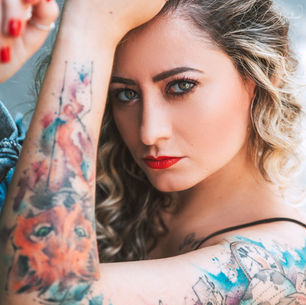 a young woman with a tattooed arm