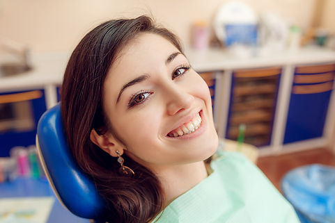 smiling young woman at dentist