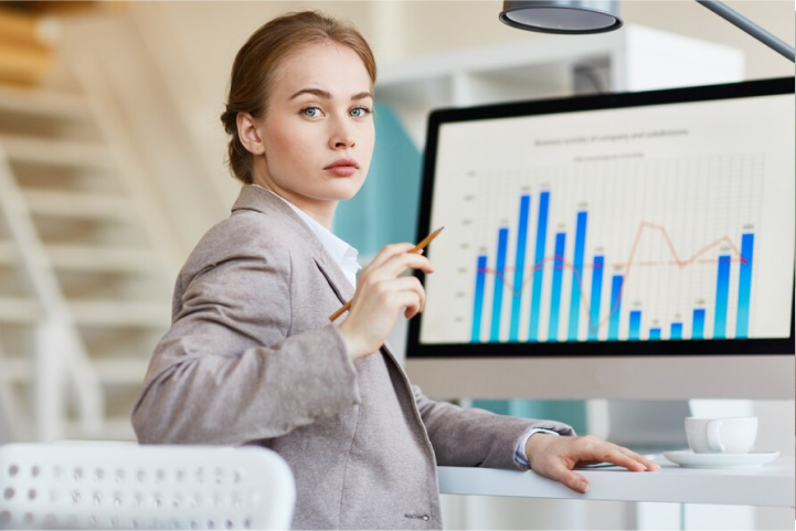 Businesswoman reviewing financial charts