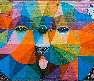 Large mural of a multi-colored lion at San Luis Obispo Museum of Art