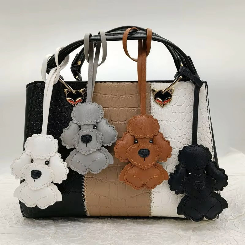 Oodle bag charms on a handbag by Hendricks and Maple