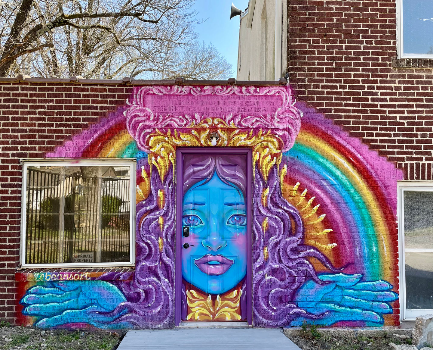 mural of  peaceful blue skinned rainbow goddess 