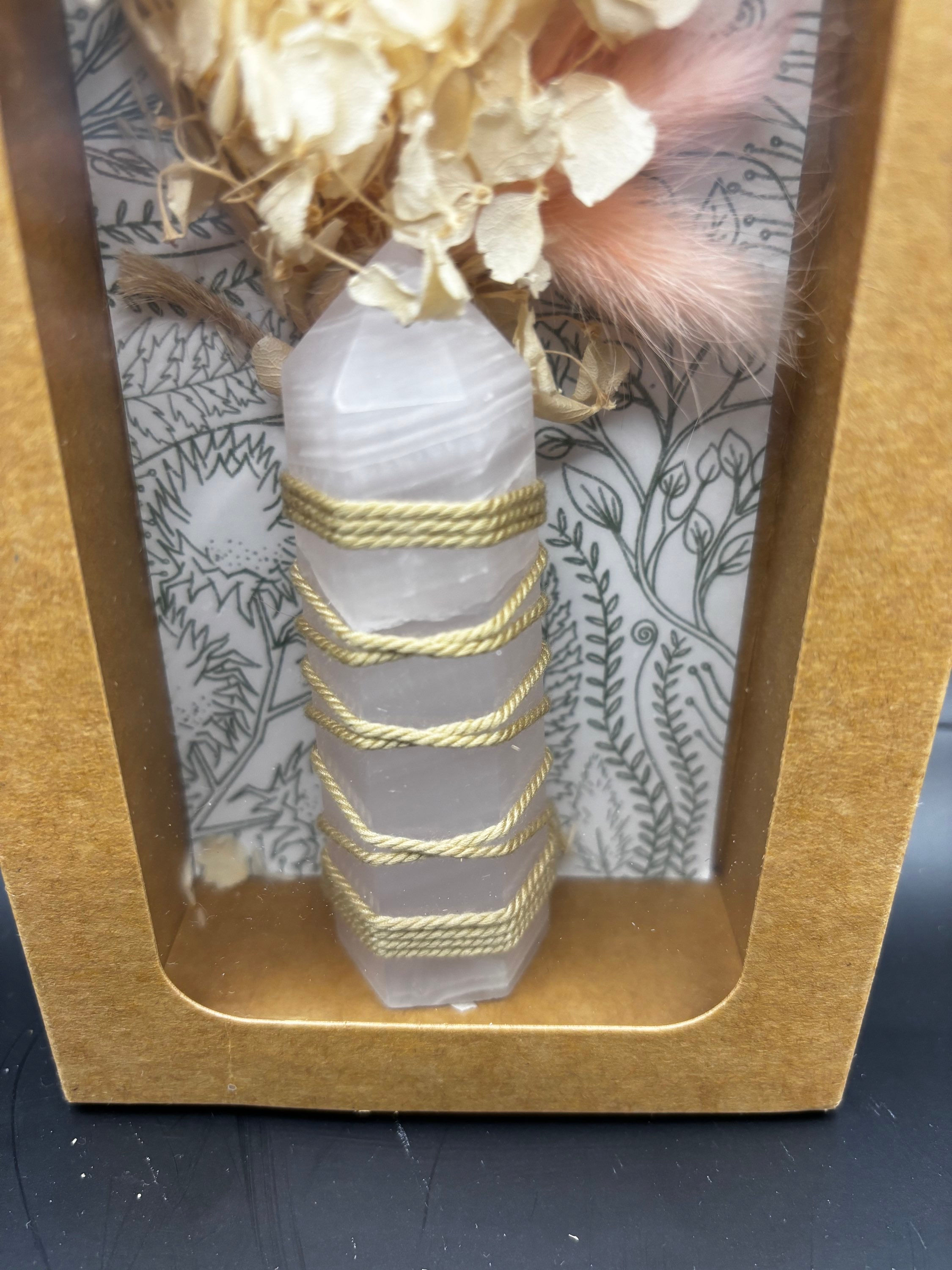 Rose quartz tower and dried floral 