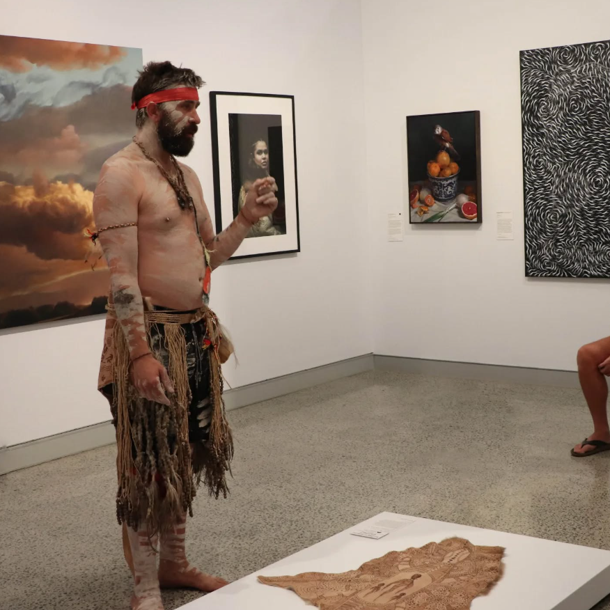 Nathan the artist standing in an art gallery