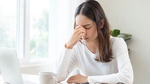 A women exhausted from everything coming at her