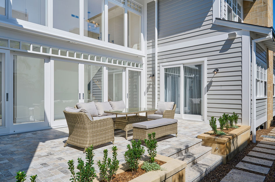 display home furniture fittings fixtures bath tube lounge vanity unit powder room chairs couch carpet mat sunset green grass