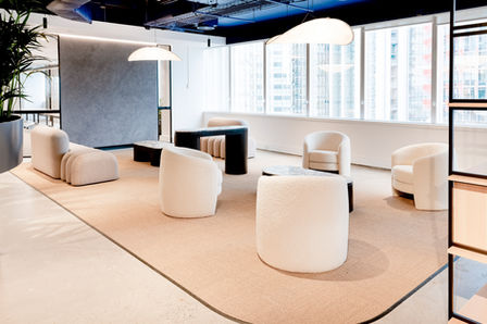 Contemporary commercial lounge with curved upholstered seating and soft pendant lighting.
Modern commercial lounge area featuring curved upholstered chairs, low tables, and sculptural pendant lights beside large windows.
Contemporary commercial interior showcasing a soft lounge setting with curved seating, textured finishes, and sculptural pendant lighting within an open-plan workspace.
A refined commercial lounge interior with curved upholstered seating, neutral textures, low tables, and sculptural pendant lights, designed for informal meetings and relaxation.
Modern office lounge with curved seating and pendant lighting. Sydney commercial interiors photography.